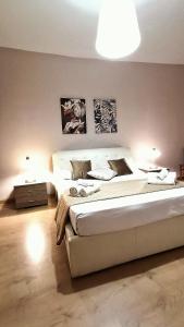 Postel nebo postele na pokoji v ubytování La Terrazza Di Athena sweet rooms