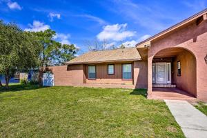 a house with a grass yard in front of it at Lakeland Vacation Rental 38 Mi to Disney! in Lakeland