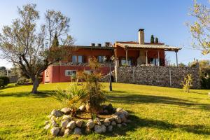 a house with a garden in front of it at Amara Haven in Aígio