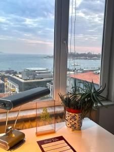 a desk with a window with a view of the ocean at House of Design *Hagia Sophia View* in Istanbul