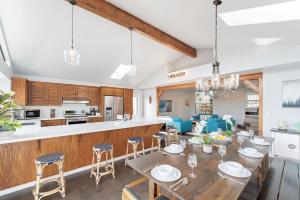 a kitchen and dining room with a wooden table and chairs at 3849 La Vista Portola home in Del Rey Oaks