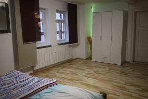 an empty room with a bed and a closet at Romantisches Main Erlebnis in Gemünden