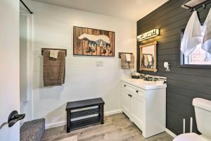 a bathroom with black and white walls and a sink at Hot Tub and Deck Pet-Friendly Home in Payson in Payson +24 photos