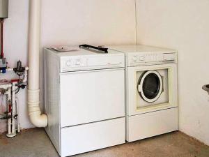 a washing machine and a washer in a room at 2 person holiday home in Bogense-By Traum in Bogense +17 photos