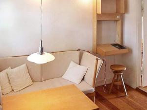 a living room with a couch and a table at 2 person holiday home in Bogense-By Traum in Bogense