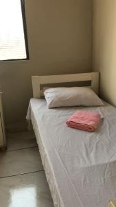 Postel nebo postele na pokoji v ubytování Hostel Gomes