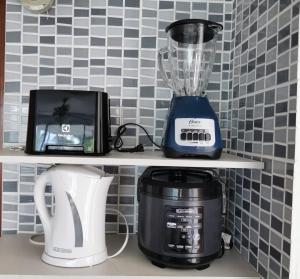 a blender and a toaster sitting on a shelf at Coti’s house in Río Hato