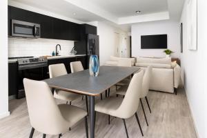 a kitchen and dining room with a table and chairs at The Elser Hotel Miami in Miami