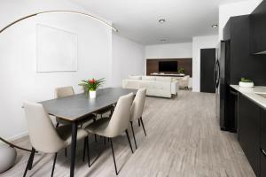 a kitchen and dining room with a table and chairs at The Elser Hotel Miami in Miami