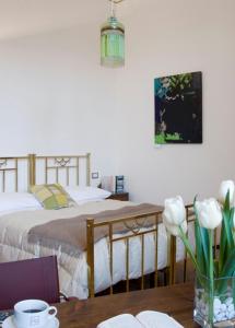 Postel nebo postele na pokoji v ubytování Palazzo De Giorgi B&B