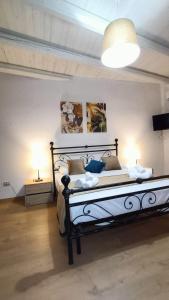 Postel nebo postele na pokoji v ubytování La Terrazza Di Athena sweet rooms