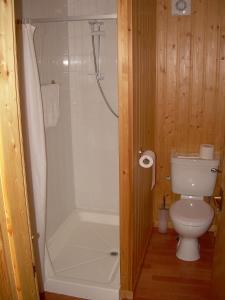 a white toilet sitting next to a bath tub at Spean Bridge Hotel in Spean Bridge