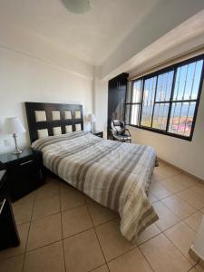 Ένα ή περισσότερα κρεβάτια σε δωμάτιο στο Casa Vista hermosa de taxco