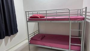 a couple of bunk beds in a room at Homestay Mama, Kota Bharu in Kota Bharu