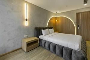 Ένα ή περισσότερα κρεβάτια σε δωμάτιο στο Jacayl Hotel TCG