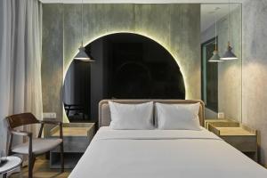 Ένα ή περισσότερα κρεβάτια σε δωμάτιο στο Jacayl Hotel TCG
