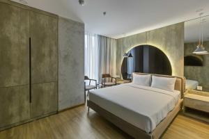 Ένα ή περισσότερα κρεβάτια σε δωμάτιο στο Jacayl Hotel TCG