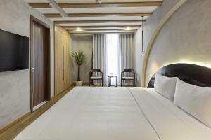 Ένα ή περισσότερα κρεβάτια σε δωμάτιο στο Jacayl Hotel TCG