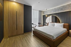Ένα ή περισσότερα κρεβάτια σε δωμάτιο στο Jacayl Hotel TCG