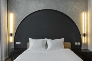 Ένα ή περισσότερα κρεβάτια σε δωμάτιο στο Jacayl Hotel TCG