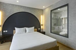 Ένα ή περισσότερα κρεβάτια σε δωμάτιο στο Jacayl Hotel TCG