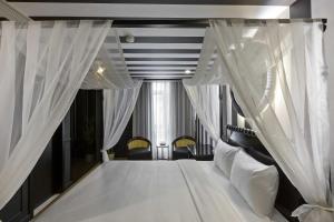 Ένα ή περισσότερα κρεβάτια σε δωμάτιο στο Jacayl Hotel TCG