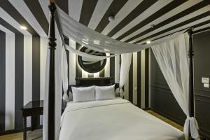 Ένα ή περισσότερα κρεβάτια σε δωμάτιο στο Jacayl Hotel TCG