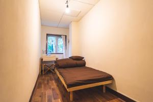 Postel nebo postele na pokoji v ubytování Sounkyo Hostel