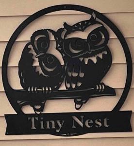 a sign for a tiny nest with two owls at Tiny House with private Hot Tub near Seattle in Shoreline