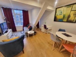 a living room with a table and chairs at Garland City Centre Apartment, Crayford-Dartford in Crayford