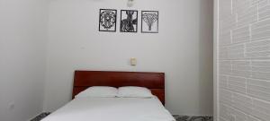 Postel nebo postele na pokoji v ubytování Apartamento Santorini Colombiano