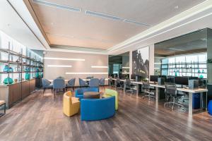 an office with desks and chairs and tables at Seda Nuvali in Santa Rosa