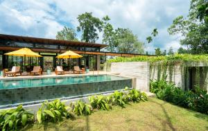 a swimming pool in the backyard of a house at Villa Alba - Ahangama in Ahangama