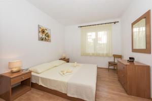 Postel nebo postele na pokoji v ubytování Apartment Katarina