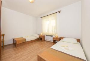 Postel nebo postele na pokoji v ubytování Apartment Katarina