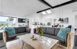a living room with couches and a table at Gorgeous Home In Haderslev With Wifi in Haderslev