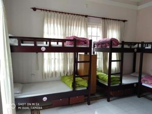 a group of bunk beds in a room at City Pass Da Lat in Da Lat