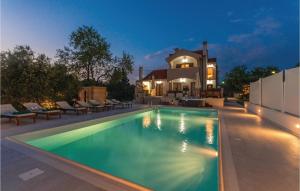 a swimming pool in front of a house at Stunning Home In Donji Zemunik With House A Panoramic View in Zemuniki