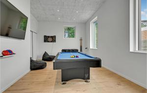 a room with a pool table in the middle of it at 6 Bedroom Cozy Home In Ebeltoft in Ebeltoft