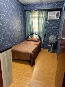 Łóżko lub łóżka w pokoju w obiekcie Place Staycation
