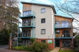 an apartment building with balconies on a street at Southampton Serviced Apartments in Southampton