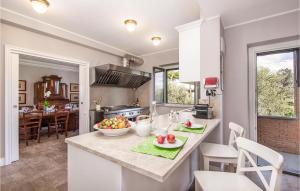 a kitchen with a counter with a bowl of fruit on it at Beautiful Home In Anguillara Sabazia With 11 Bedrooms, Private Swimming Pool And Outdoor Swimming Pool in Anguillara Sabazia
