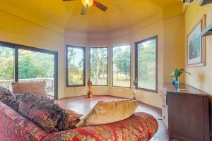 a living room with a couch and some windows at Casita at Morningstar Breeze Gold Standard Certified in Hopkins