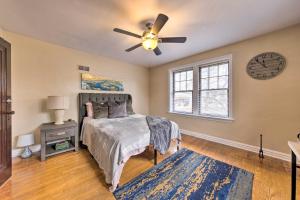 a bedroom with a bed and a ceiling fan at St Louis Vacation Rental 4 Mi to Airport! in Woodson Terrace