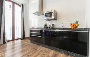 A kitchen or kitchenette at Amazing Apartment In Sevilla With Wifi