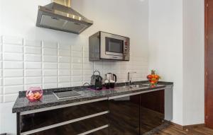 A kitchen or kitchenette at Amazing Apartment In Sevilla With Wifi