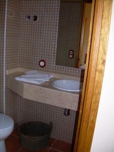 a bathroom with a sink and a toilet at Casa Rural el Castellet in La Jana