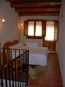 Łóżko lub łóżka w pokoju w obiekcie Casa Rural el Castellet