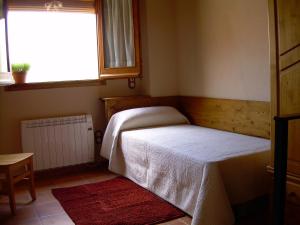 Łóżko lub łóżka w pokoju w obiekcie Casa Rural el Castellet
