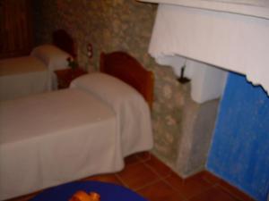 Łóżko lub łóżka w pokoju w obiekcie Casa Rural el Castellet